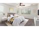 Stylishly decorated bedroom with natural light, a large bed, and modern decor for comfortable living at 4368 E Cullumber St, Gilbert, AZ 85234