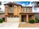 Charming two-story home featuring a stone facade, balcony, well-maintained landscaping and a two car garage at 4368 E Cullumber St, Gilbert, AZ 85234
