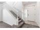 Bright foyer with staircase and neutral finishes providing an inviting entrance to the home at 4368 E Cullumber St, Gilbert, AZ 85234