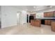 Bright kitchen area featuring an island, ample cabinet space, and modern appliances at 4368 E Cullumber St, Gilbert, AZ 85234
