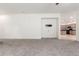 Spacious living room with carpet and neutral paint, open to the kitchen and dining areas at 4368 E Cullumber St, Gilbert, AZ 85234
