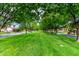 Neighborhood showcases lush green lawns and mature trees along a quiet residential street at 4368 E Cullumber St, Gilbert, AZ 85234