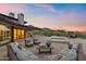 Luxury backyard with a firepit, modern outdoor seating, a pool and mountain views at 4536 E Foothill Dr, Paradise Valley, AZ 85253