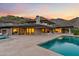Stunning backyard featuring a modern pool and spa overlooking beautiful mountain views at 4536 E Foothill Dr, Paradise Valley, AZ 85253