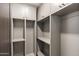 Spacious walk-in closet with custom built-in shelving, providing ample storage and organization solutions at 4536 E Foothill Dr, Paradise Valley, AZ 85253