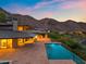 Modern home exterior featuring an infinity pool with an outdoor living space at 4536 E Foothill Dr, Paradise Valley, AZ 85253