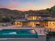 Stunning contemporary home featuring an infinity pool and an outdoor living area at 4536 E Foothill Dr, Paradise Valley, AZ 85253