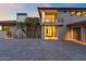 Modern home with paver driveway, desert landscaping, and a covered balcony offering natural light and views at 4536 E Foothill Dr, Paradise Valley, AZ 85253