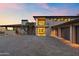 Stately home with desert landscaping, a paver driveway, and attached garage under a vibrant sunset sky at 4536 E Foothill Dr, Paradise Valley, AZ 85253