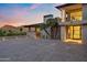 Elegant home entrance featuring a paved driveway, desert landscaping, and modern architectural details at 4536 E Foothill Dr, Paradise Valley, AZ 85253
