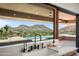 Modern kitchen sink with large window overlooking a pool and desert landscape at 4536 E Foothill Dr, Paradise Valley, AZ 85253
