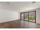 Minimalist living room with expansive windows offering private views of natural rock formations and native plants at 4536 E Foothill Dr, Paradise Valley, AZ 85253