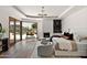 Main bedroom with hardwood floors, access to a pool, seating near a fireplace, and a neutral color palette at 4536 E Foothill Dr, Paradise Valley, AZ 85253