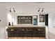 Stylish wet bar features tiled backsplash, marble countertop, and stainless steel wine fridge at 4536 E Foothill Dr, Paradise Valley, AZ 85253