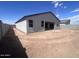 Exterior rear view of home with a large yard and privacy fence at 47253 W Pecan Woods --, Maricopa, AZ 85139