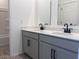 Stylish bathroom featuring a double sink vanity with modern fixtures and a large mirror, complemented by neutral decor at 47253 W Pecan Woods --, Maricopa, AZ 85139