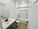 Well-lit bathroom featuring a vanity, toilet, and shower-tub combination with updated fixtures at 47253 W Pecan Woods --, Maricopa, AZ 85139
