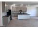 Open kitchen with gray cabinets, dark countertops, and stainless steel appliances at 47253 W Pecan Woods --, Maricopa, AZ 85139