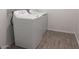 Laundry room with new, white, side-by-side washer and dryer at 47253 W Pecan Woods --, Maricopa, AZ 85139
