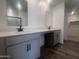Dual sink bathroom featuring white counters and dark fixtures at 47748 W Moeller Rd, Maricopa, AZ 85139