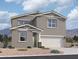 Charming two-story home with neutral stucco exterior, well-manicured landscaping, and a spacious two car garage at 47748 W Moeller Rd, Maricopa, AZ 85139