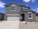 Charming two-story home with neutral stucco exterior, well-manicured landscaping, and a spacious two car garage at 47748 W Moeller Rd, Maricopa, AZ 85139