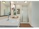 Bright bathroom with a double sink vanity, quartz countertop, and glass shower at 5011 E Nisbet Rd, Scottsdale, AZ 85254