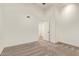 Bedroom showcases neutral carpet, baseboards, window, door to hallway, and ample lighting and outlets at 5011 E Nisbet Rd, Scottsdale, AZ 85254