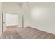 This bedroom features an open doorway and new carpet throughout the room at 5011 E Nisbet Rd, Scottsdale, AZ 85254