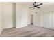 Spacious bedroom with carpet, ceiling fan, and double closets at 5011 E Nisbet Rd, Scottsdale, AZ 85254