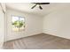 Bedroom with a large window that provides backyard view at 5011 E Nisbet Rd, Scottsdale, AZ 85254