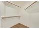 Walk-in closet with custom wood shelving and wood-look floors at 5011 E Nisbet Rd, Scottsdale, AZ 85254