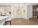 Dining area with chandelier lighting and a view of fireplace at 5011 E Nisbet Rd, Scottsdale, AZ 85254