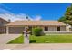 Charming home with manicured lawn and inviting curb appeal at 5011 E Nisbet Rd, Scottsdale, AZ 85254