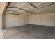 Spacious garage with concrete floor, door to home, and painted walls at 5011 E Nisbet Rd, Scottsdale, AZ 85254
