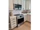 Kitchen features modern stainless steel oven, microwave, and white cabinetry at 5011 E Nisbet Rd, Scottsdale, AZ 85254