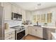 Bright kitchen with white cabinets, stainless steel appliances, and stylish countertops at 5011 E Nisbet Rd, Scottsdale, AZ 85254