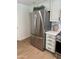 Kitchen showcases stainless steel refrigerator, light countertops and white cabinets at 5011 E Nisbet Rd, Scottsdale, AZ 85254