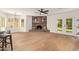 Living room features a fireplace and double doors with a view of the yard at 5011 E Nisbet Rd, Scottsdale, AZ 85254