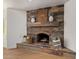 Living room featuring wood fireplace, mantel, and tiled floor at 5011 E Nisbet Rd, Scottsdale, AZ 85254