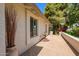 Charming side patio with flagstone flooring and vibrant landscaping, offering a peaceful outdoor space at 5011 E Nisbet Rd, Scottsdale, AZ 85254