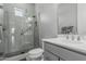 Clean bathroom with a glass shower and contemporary vanity at 5233 N 207Th Dr, Buckeye, AZ 85396
