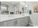 Bright bathroom featuring double sinks, quartz countertops, and a large mirror at 5233 N 207Th Dr, Buckeye, AZ 85396