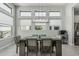 Bright dining room featuring a modern chandelier and oversized windows at 5233 N 207Th Dr, Buckeye, AZ 85396