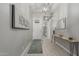 Elegant entryway featuring neutral paint, a console table, and decor at 5233 N 207Th Dr, Buckeye, AZ 85396