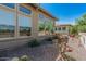 Landscaped exterior view showcasing the home's beautiful desert surroundings at 5233 N 207Th Dr, Buckeye, AZ 85396