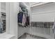 Spacious walk-in closet with custom shelving and ample storage space at 5233 N 207Th Dr, Buckeye, AZ 85396