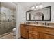 Bathroom boasts double sinks, granite countertops, and a glass-enclosed shower at 5334 E Everett Dr, Scottsdale, AZ 85254