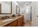 Bright bathroom featuring double sinks, granite counters, and modern fixtures at 5334 E Everett Dr, Scottsdale, AZ 85254