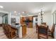 Open-concept kitchen featuring a granite island, stainless steel appliances, and an adjacent dining area at 5334 E Everett Dr, Scottsdale, AZ 85254